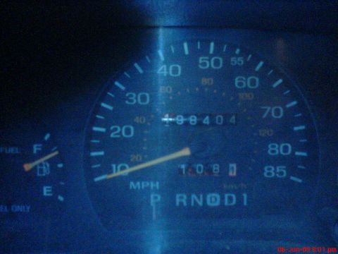 1992 Ford Crown Victoria - Close-up of a car's dashboard gauges, including the speedometer and odometer.