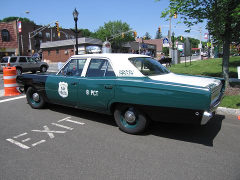 1991 Ford LTD Crown Victoria - teal-and-black four-door police sedan lettered POLICE, 8 PCT and 2382 with a single roof beacon at a town car show.