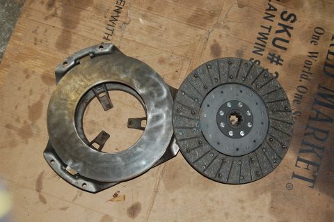 1994 Ford Bronco - Clutch disc and pressure plate assembly shown on a cardboard surface.