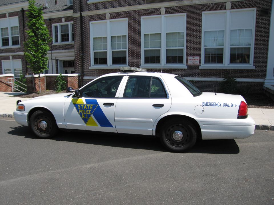 White New Jersey State Police Ford Crown Victoria parked on street