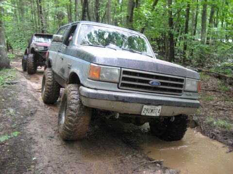 1991 Ford Bronco - This 1991 Ford Bronco navigates a muddy trail during an off-road event.