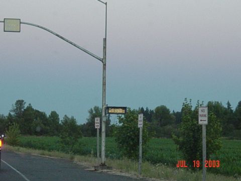1989 Ford Bronco - Digital sign showing 09350 beside a rural road on July 19, 2003.