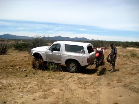1996 Ford Bronco - 1996 Ford Bronco and dirt bike ready for off-road adventure in the desert.