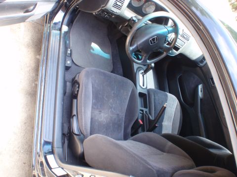 1996 Ford Bronco - Interior view of a car, showing the seats, dashboard, and steering wheel.