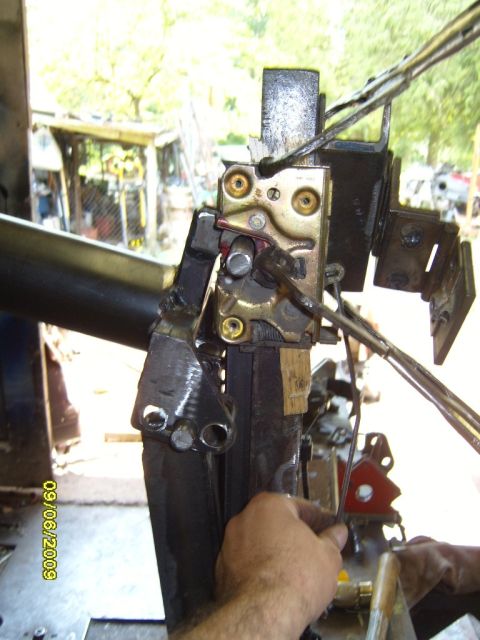1989 Ford Bronco - Close-up of a vehicle's door latch mechanism, with a visible date stamp of 09/06/2009.