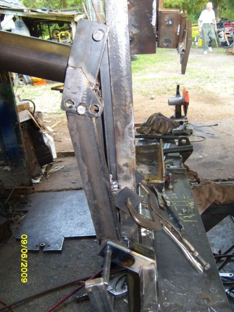 1989 Ford Bronco - Metal parts are being welded and assembled in an outdoor workshop setting. A date stamp shows 09/06/2009.