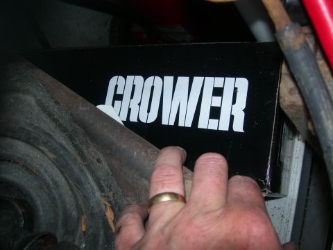 1984 Ford Bronco - A hand holds a black box with the brand name "CROWER" visible, near vehicle components.