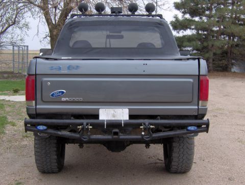 1987 Ford Bronco - This 1987 Ford Bronco features a soft top and a heavy-duty aftermarket rear bumper.