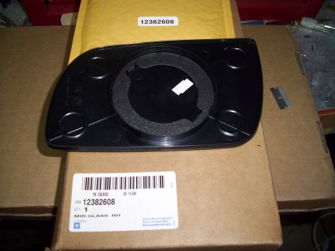 1993 Ford Probe - Side mirror glass part number 12382608 is shown from the rear, mounted on a cardboard box.