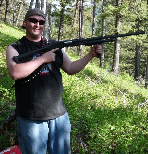2006 Ford E350 - Me with my NEF Pardner NP1-228 pump 12ga shotgun. It's 42" long from the tip of the barrel to the top end of the stock.