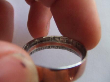 1996 Ford Bronco - A ring crafted from a coin, with visible text indicating its origin.