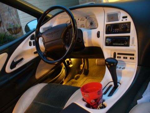 1995 Ford Thunderbird - Interior view of a 1995 Ford Thunderbird, highlighting the dashboard and console.