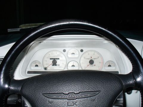 1995 Ford Thunderbird - The dashboard features white-faced gauges and a prominent steering wheel with an LX emblem.