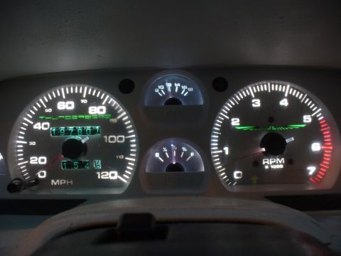 1995 Ford Thunderbird - The illuminated dashboard gauges of a 1995 Ford Thunderbird show an odometer reading of 197,801 miles.