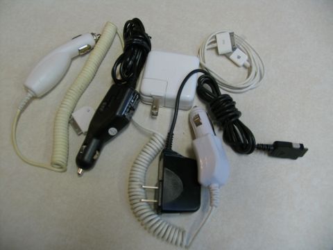 1984 Ford Bronco - Collection of various electronic chargers and cables for different devices.