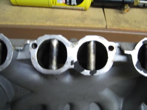 1963 Ford Galaxie - This is a close-up view of an engine's intake manifold, showing the ports for air intake.