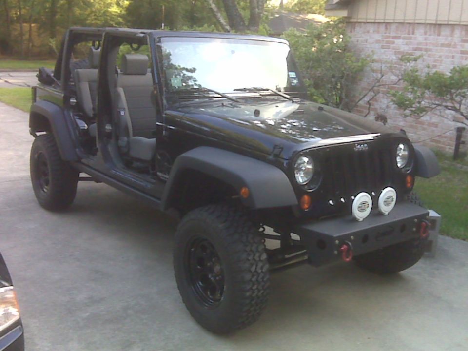 Black Jeep Wrangler, doors off, 3/4 front view