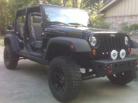 2008 Jeep Wrangler - This Jeep Wrangler has an aftermarket bumper and off-road tires, with its doors removed.
