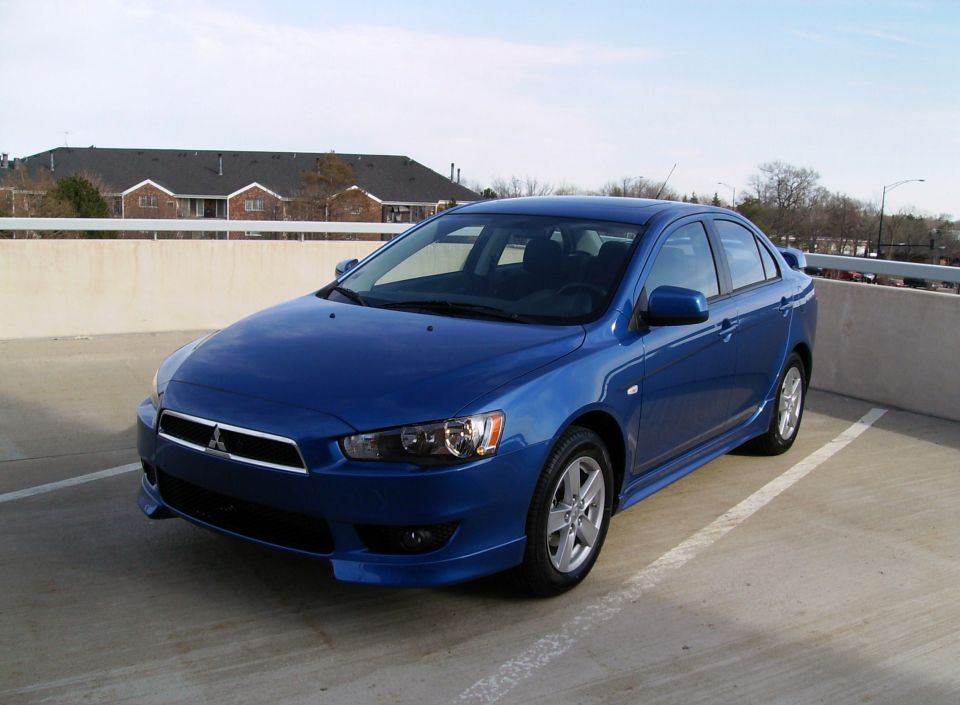 Blue 2009 Mitsubishi Lancer sedan, 3q front view