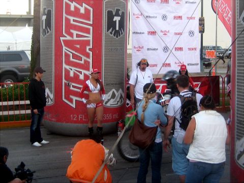 1996 Ford Bronco - Event setup with a giant Tecate beer can and attendees near a banner.