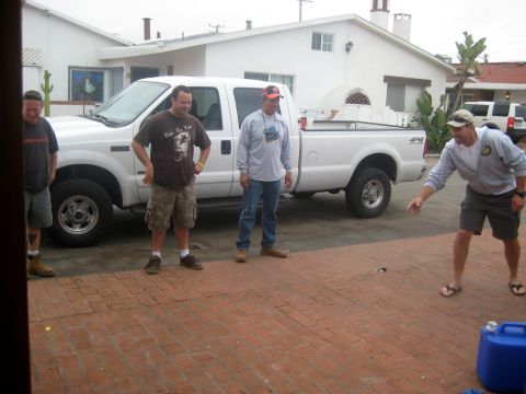 1996 Ford Bronco - A white Ford F-250 Super Duty pickup truck is parked on a brick patio while four men stand around it.