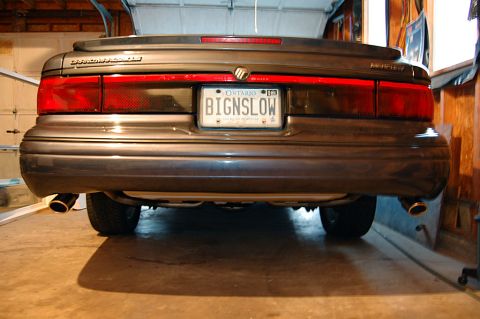 1985 Mercury Grand Marquis - The rear of a 1985 Mercury Grand Marquis is shown, its distinctive taillights and license plate.