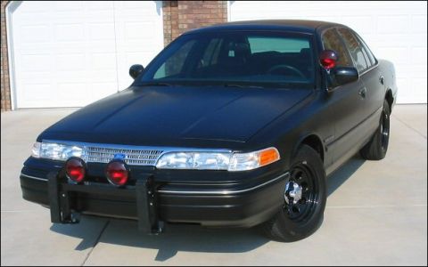 1998 Ford Crown Victoria - This black 1998 Ford Crown Victoria is equipped with a push bar and auxiliary lights.