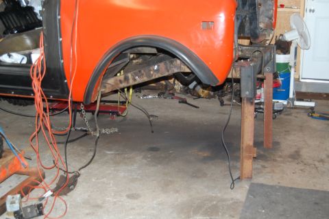 1994 Ford Bronco - Vehicle body and frame are visible, with suspension parts and wiring exposed during work.
