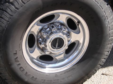 1973 Ford Ranchero - Close-up of a vehicle's wheel and tire, showing chrome accents and tire tread details.