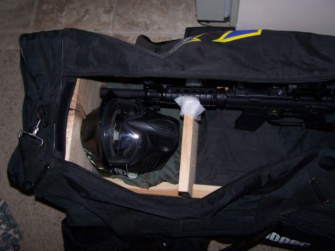 1986 Ford Bronco - Contents of a tactical gear bag, including a rifle and protective mask.