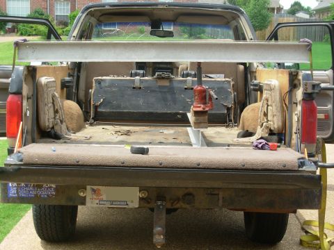 1983 Ford Bronco - The strap started off just snug, so it's stretching noticeably. The rags are being cut by the immense force, which is why they're there. No…