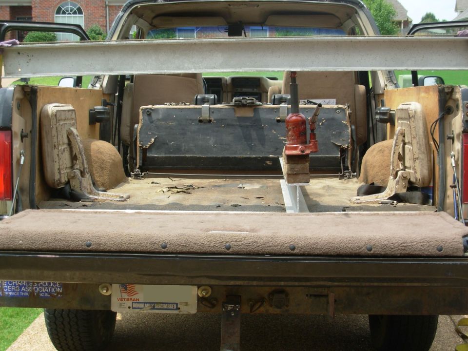 Yes, the beam is bending, too.  And there's a real risk of the jack shooting out from under the beam & strap if the handle is operated too forcibly.