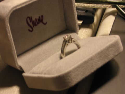 2001 Ford F-150 - A diamond ring rests in its velvet box, which is embroidered with the name 'Shane'.