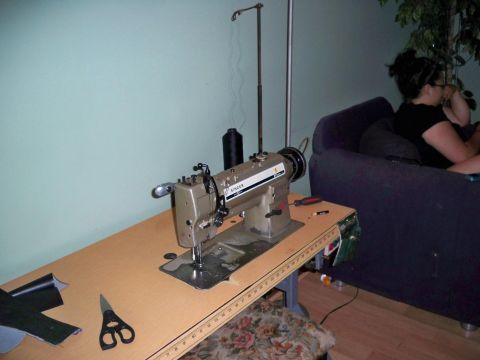 1995 Ford Probe - Singer industrial sewing machine set up on a workbench with sewing supplies nearby.