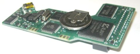 1996 Ford Bronco - This electronic circuit board features various integrated circuits, a coin cell battery, and a connector, likely for data or power.