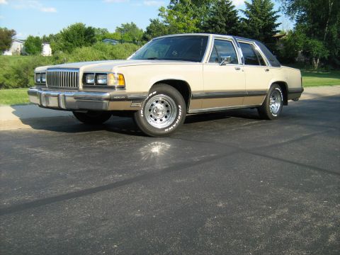 1988 Mercury Grand Marquis - This 1988 Mercury Grand Marquis is shown in a three-quarter front view, highlighting its two-tone paint scheme.