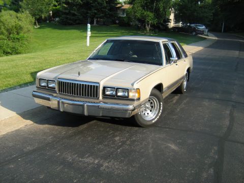 1988 Mercury Grand Marquis - This 1988 Mercury Grand Marquis is parked on a residential driveway.