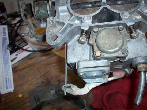 1978 Jeep CJ5 - A close-up view of a carburetor, showing mechanical details and a prominent number 5 marking.