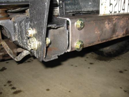 1993 Ford Bronco - Close-up of a custom bumper mount with visible hardware and a license plate.