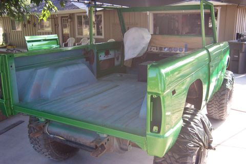 1976 Ford Bronco - This 1976 Ford Bronco is shown in a bright green finish, likely during a restoration project.