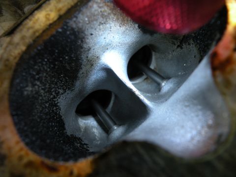 1998 Subaru Legacy - Engine cylinder head detail with intake and exhaust valves visible.