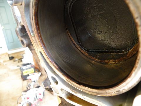 1998 Subaru Legacy - This is a close-up view of an engine cylinder, showing signs of wear and carbon deposits.