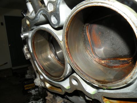 1998 Subaru Legacy - The interior of two engine cylinders shows significant wear and carbon deposits, indicating a need for repair or replacement.