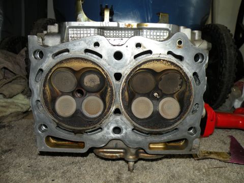 1998 Subaru Legacy - Close-up of an engine cylinder head, showing the intake and exhaust valves.