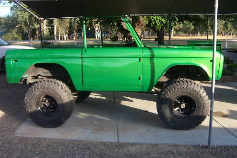 1976 Ford Bronco - This modified 1976 Ford Bronco is painted a vibrant green and features oversized off-road tires.