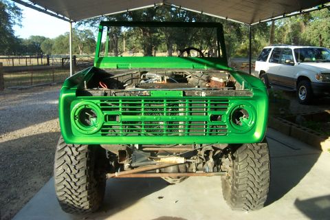 1976 Ford Bronco - This 1976 Ford Bronco is shown from the front with its hood open, indicating it is likely undergoing restoration or modification.