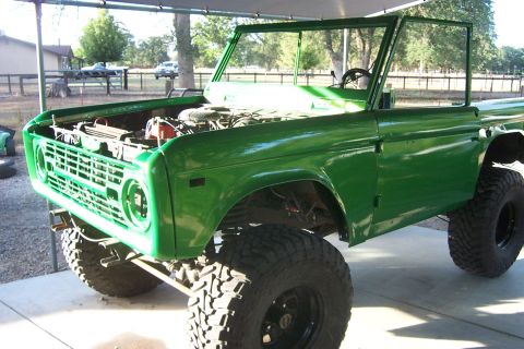 1976 Ford Bronco - This 1976 Ford Bronco is undergoing restoration with a fresh green paint job and lifted suspension.