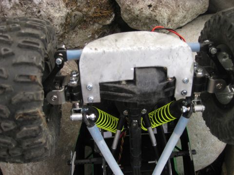2010 Ford Pickup - Close-up view of the suspension and drivetrain components of a remote-controlled car.