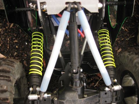 2010 Ford Pickup - Close-up view of the suspension system on a remote control car chassis.