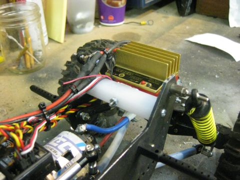 2010 Ford Pickup - Close-up view of the electronic components and wiring of a remote-controlled car.